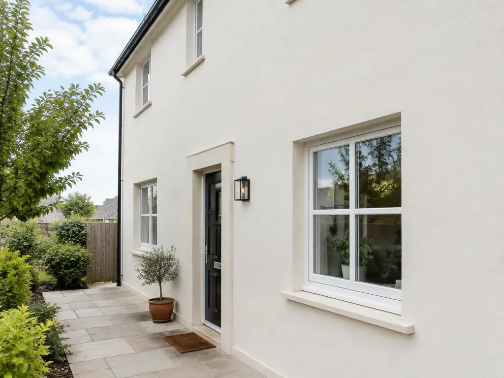 Exterior Rendering in Yorkshire Smooth off-white exterior render on a two-storey house with neat window reveals