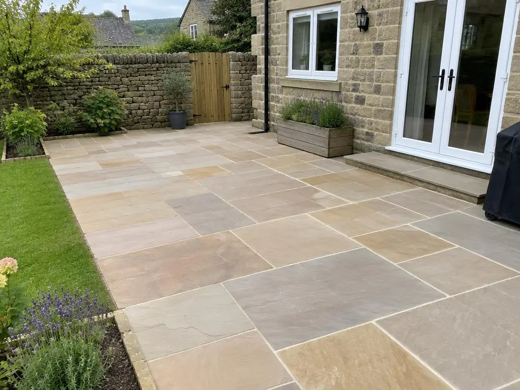 Patio Repair in Yorkshire Relaid Yorkshire sandstone patio with level flags beside a stone-built house